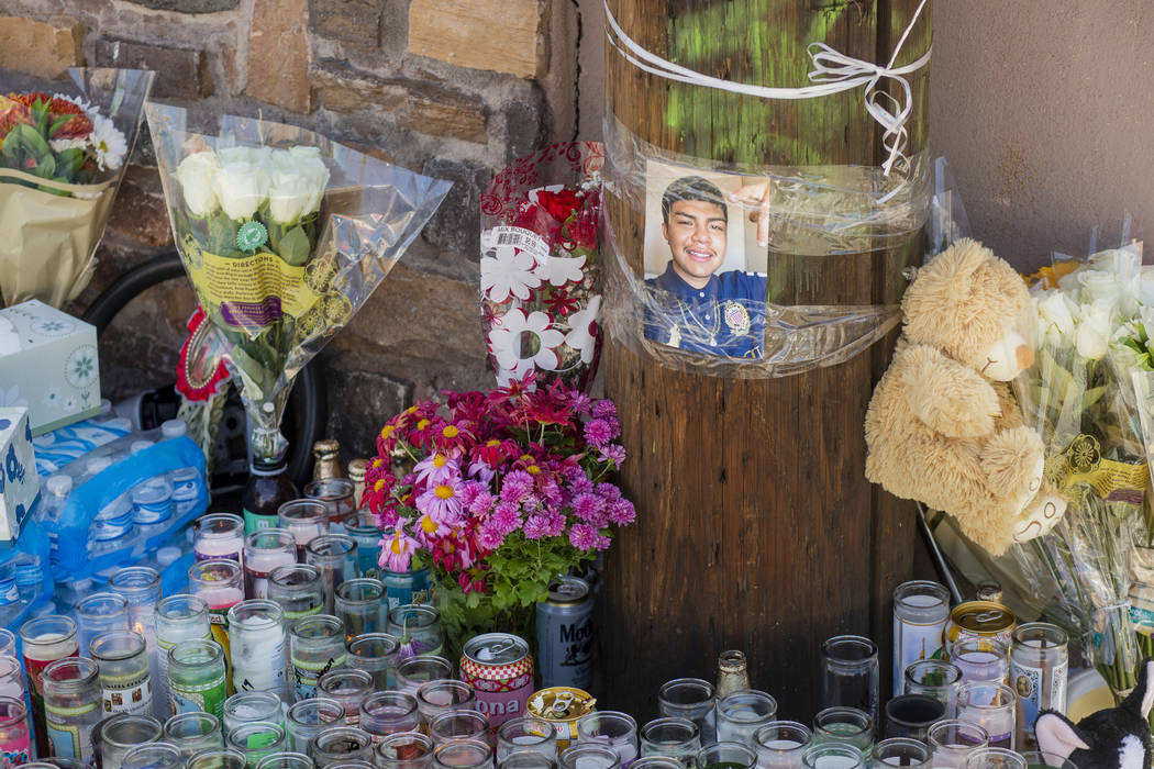 Candles burn at a memorial for Kevin Soriano, 17, of North Las Vegas, who was shot and killed S ...