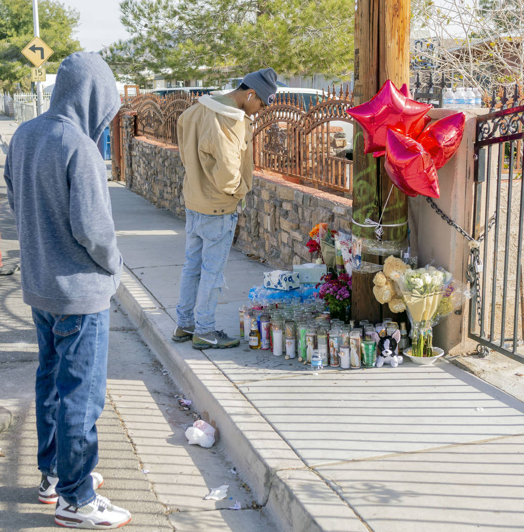 David Lopez, 18, North Las Vegas, left, and Juan Dizzle, 18, visit the memorial for Kevin Soria ...