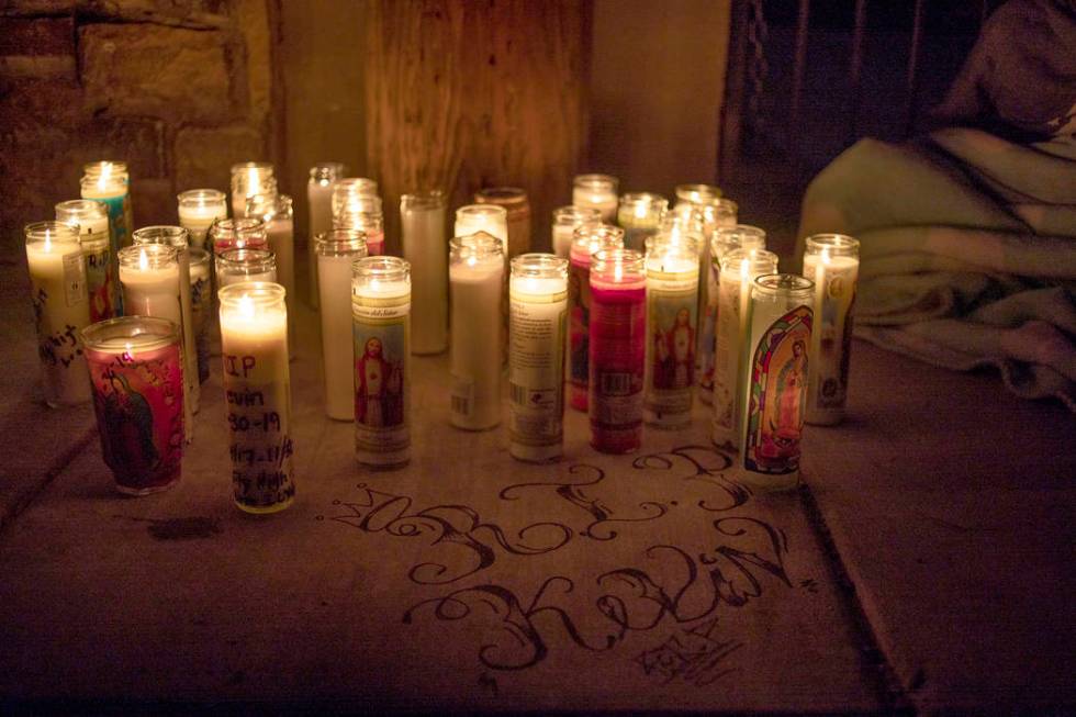 People gather to mourn a 17-year-old boy who was shot and killed near the 2600 block of Ferguso ...