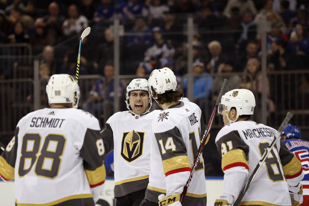 Vegas Golden Knights right wing Alex Tuch, second from left, reacts with teammates after scorin ...