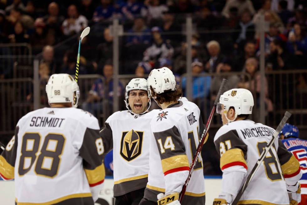 Vegas Golden Knights right wing Alex Tuch, second from left, reacts with teammates after scorin ...