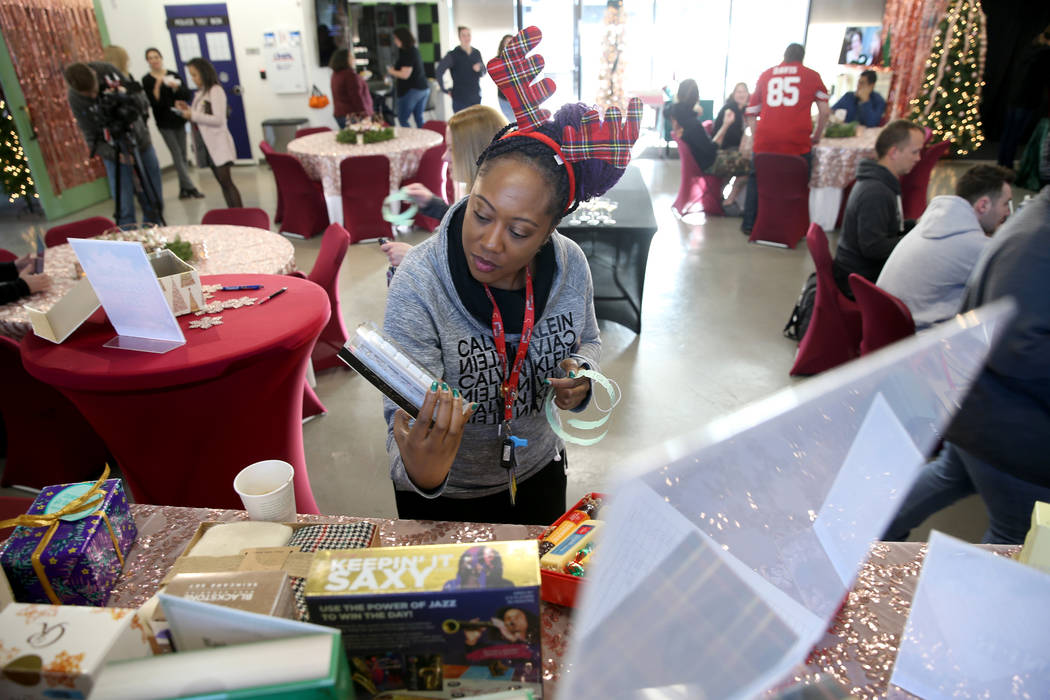 Zappos team member DeShawn Alcazar picks out a free "finer things" gift at the compan ...