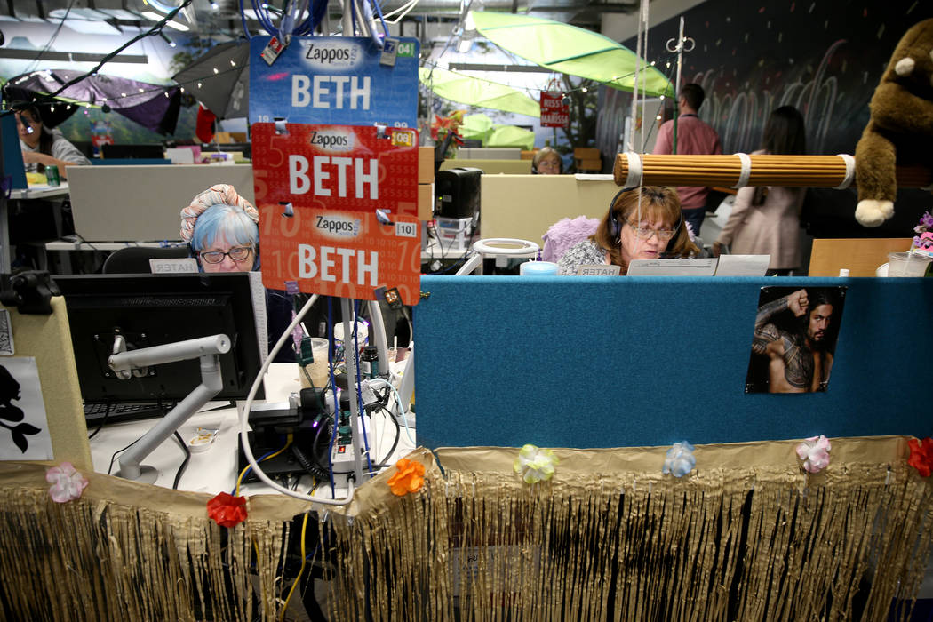 Zappos Customer Loyalty Team members, including Beth Mergenthal, left, and Terry Domingo work t ...