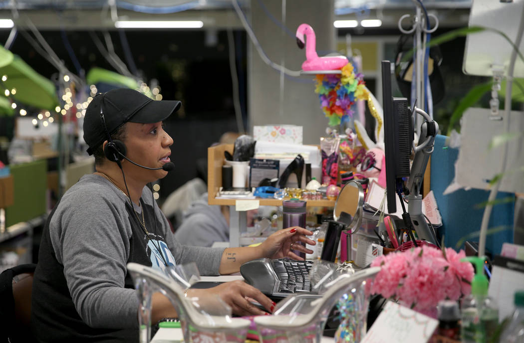 Zappos Customer Loyalty Team members, including Sanja Smith, work the phones at the company's h ...