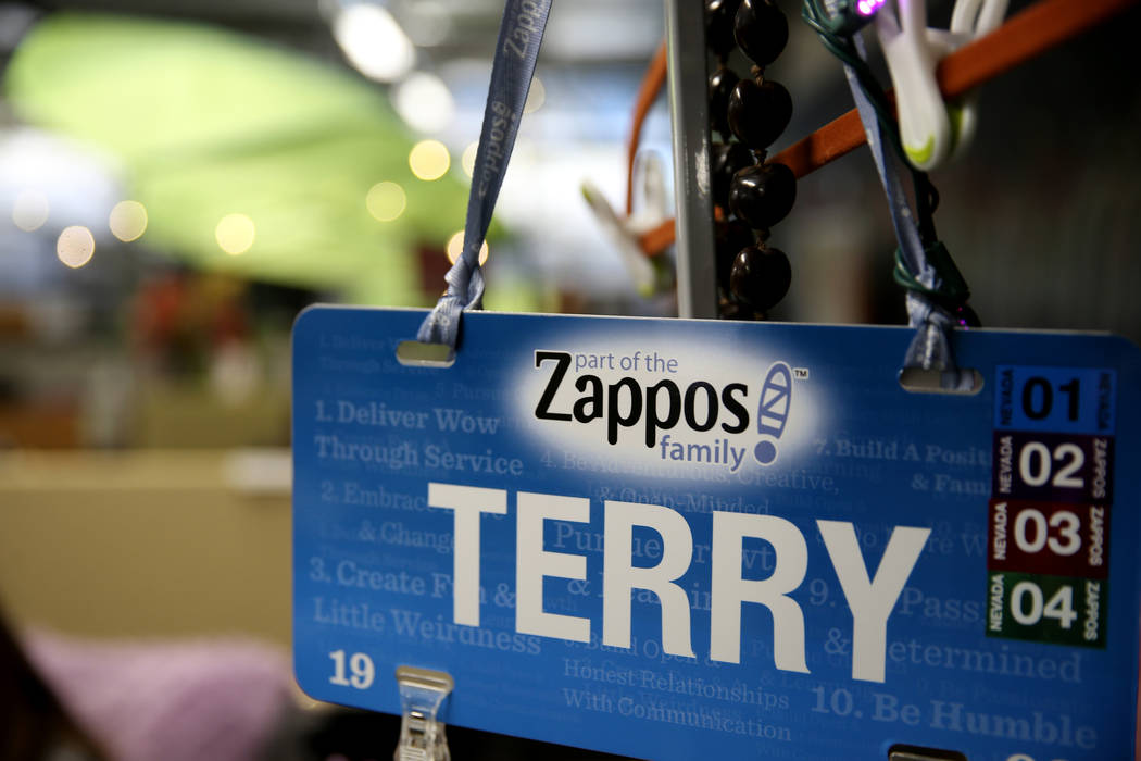 A placard for Zappos Customer Loyalty Team member Terry Domingo at her desk at the company's he ...
