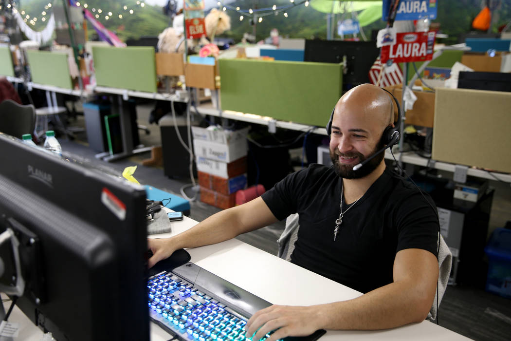 Zappos Customer Loyalty Team members, including Justin Shiloh, work the phones at the company's ...