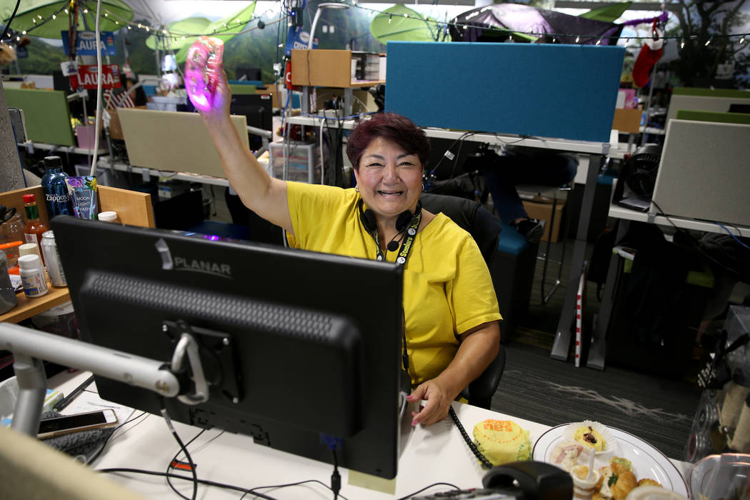Zappos Customer Loyalty Team members, including Margret Hosmer-Colen, work the phones at the co ...