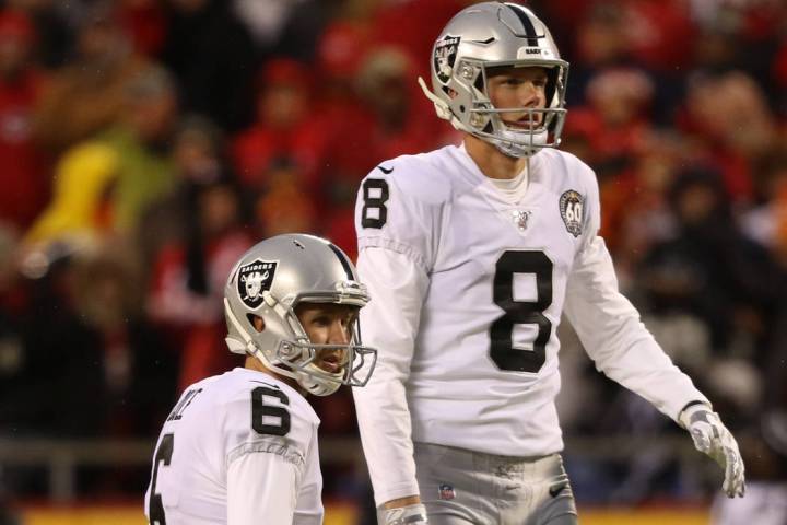 Oakland Raiders kicker Daniel Carlson (8) lines up to kick a field goal as punter A.J. Cole (6) ...