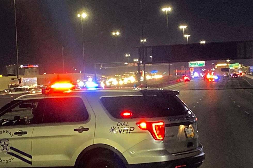 A Nevada Highway Patrol vehicle blocks Interstate 15 as troopers investigate a fatal, wrong-way ...