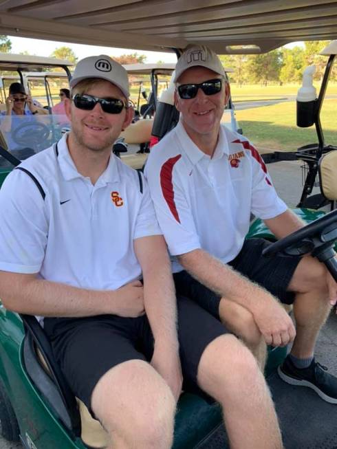 Former USC long snapper, Jake Olson (left), with help from his dad, Brian, won the United State ...