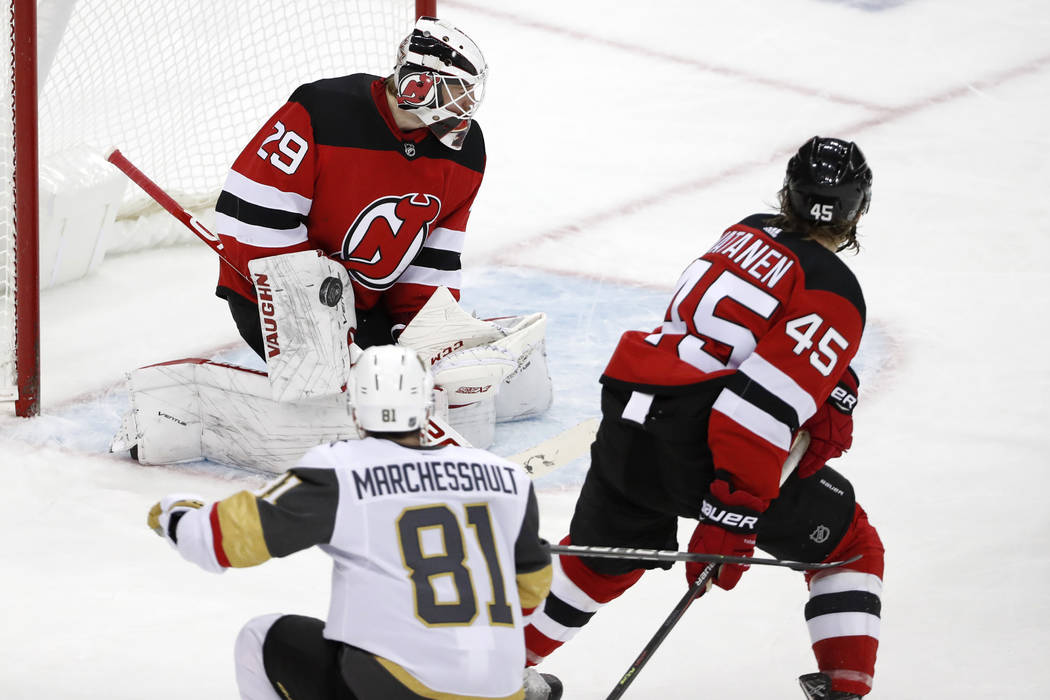 Vegas Golden Knights center Jonathan Marchessault (81) watches his shot on New Jersey Devils go ...