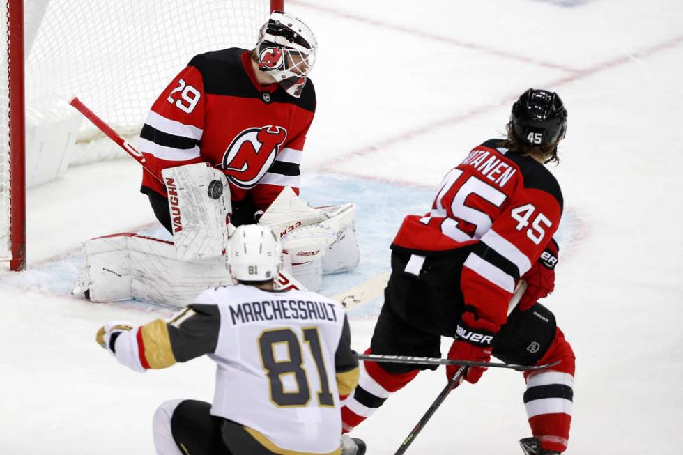 Vegas Golden Knights center Jonathan Marchessault (81) watches his shot on New Jersey Devils go ...