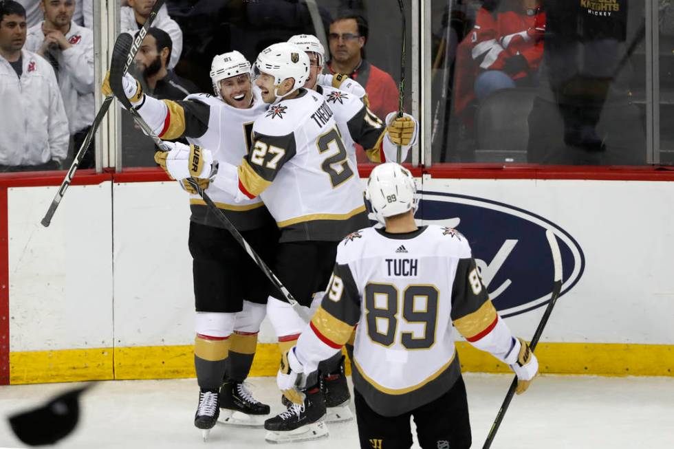 A hat sails onto the court as Vegas Golden Knights center Jonathan Marchessault (81) celebrates ...