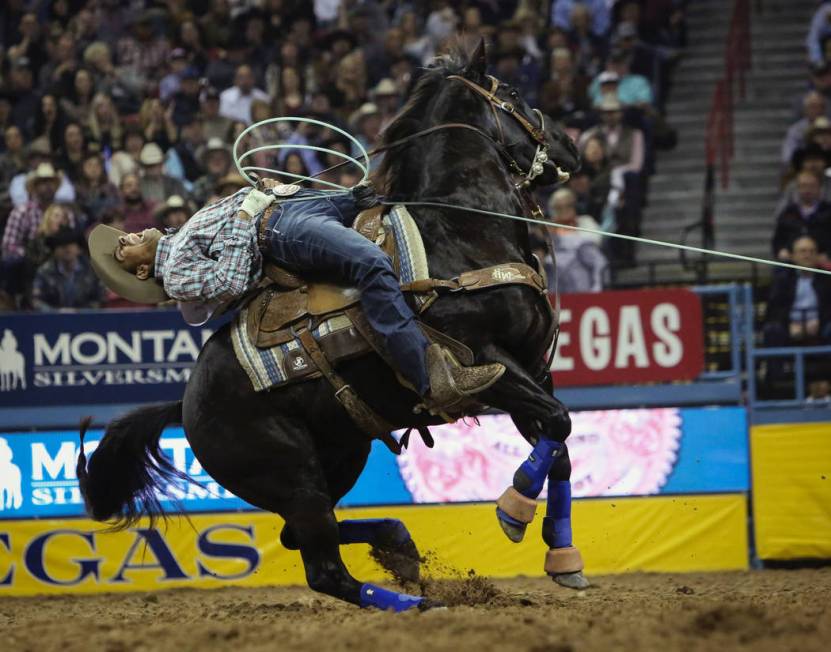 Junior Nogueira of Brazil (16) competes in team roping during the tenth go-round of the Nationa ...