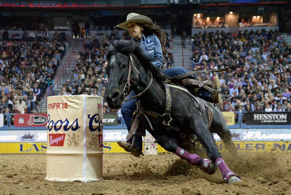 Nellie Miller of Cottonwood, Calif. (109) competes in barrel racing during the tenth go-round o ...