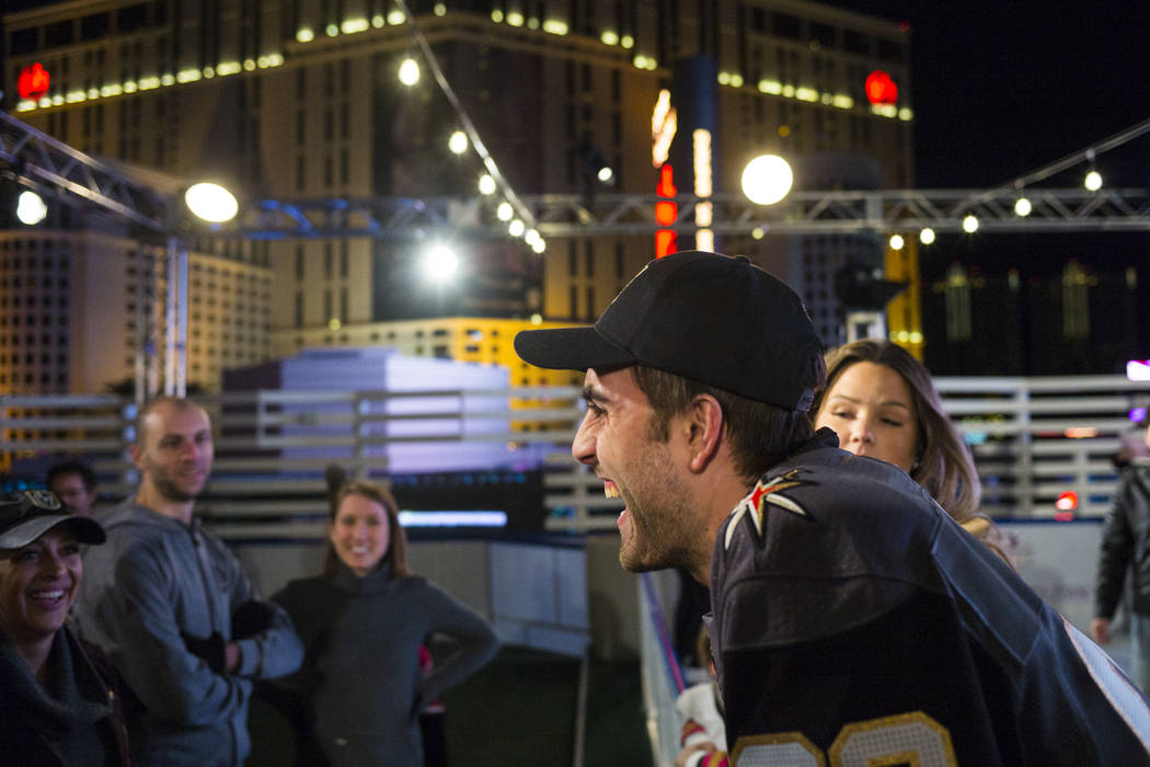 Golden Knights' Alex Tuch talks with hockey fans during the "Night With the Golden Knights ...