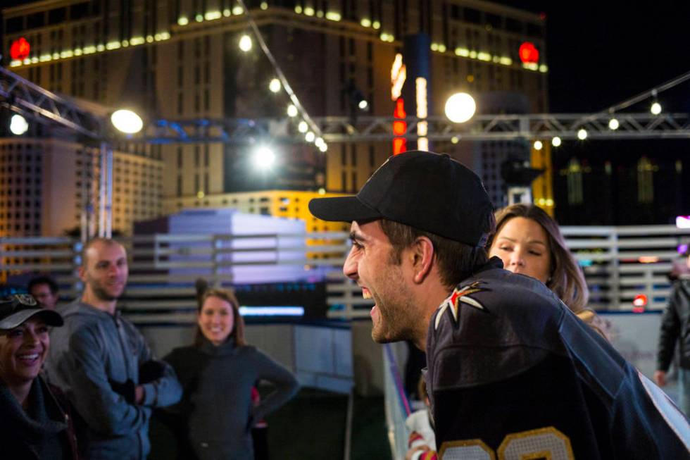 Golden Knights' Alex Tuch talks with hockey fans during the "Night With the Golden Knights ...