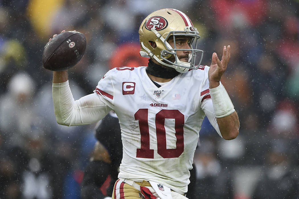 San Francisco quarterback Jimmy Garoppolo throws the ball against the Baltimore Ravens in the f ...