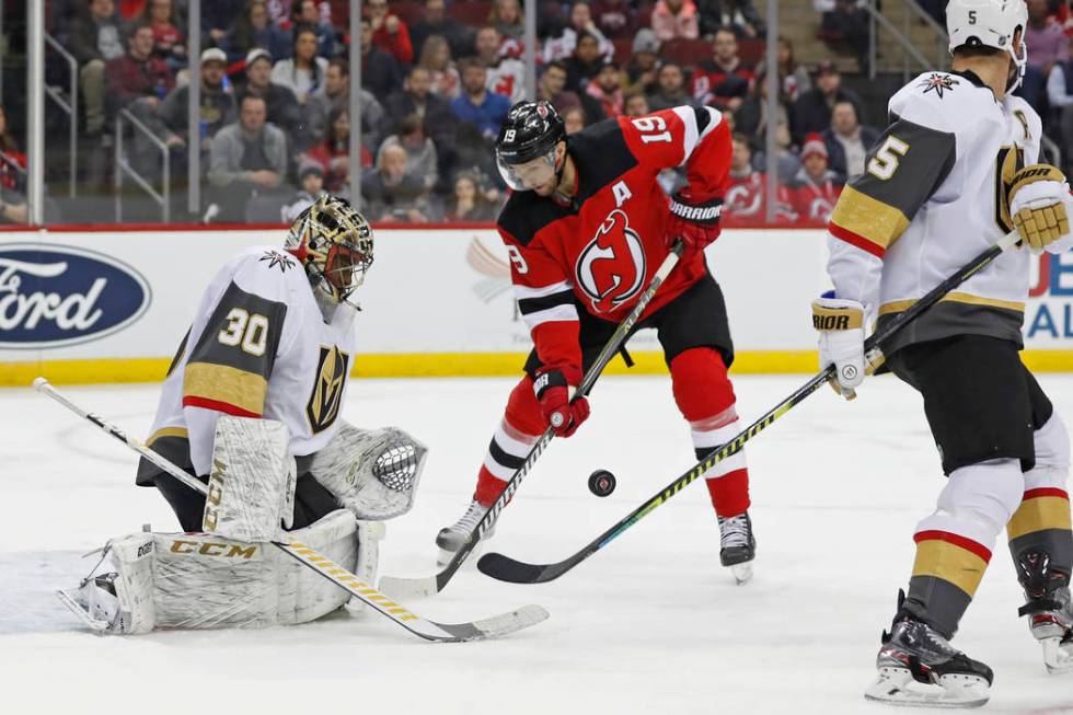 Vegas Golden Knights goaltender Malcolm Subban (30) watches the puck as it bounces in front of ...