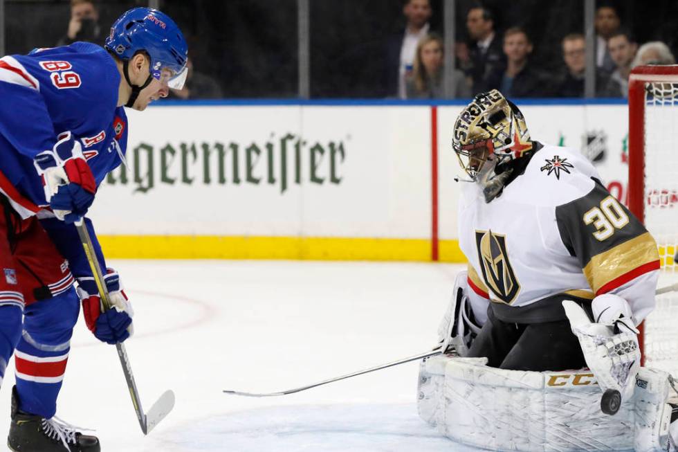 Vegas Golden Knights goaltender Malcolm Subban (30) blocks a shot by New York Rangers left wing ...