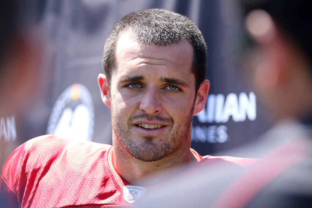 Oakland Raiders quarterback Derek Carr (4) answers media questions after a joint NFL training c ...