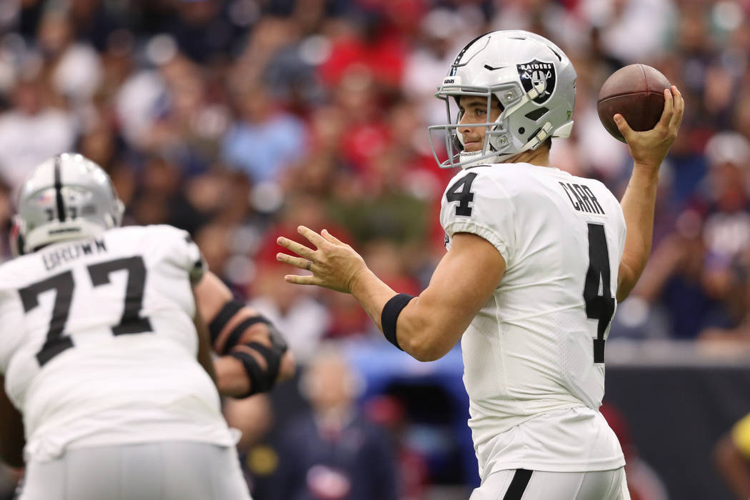Oakland Raiders quarterback Derek Carr (4) throws the football during the first half of an NFL ...