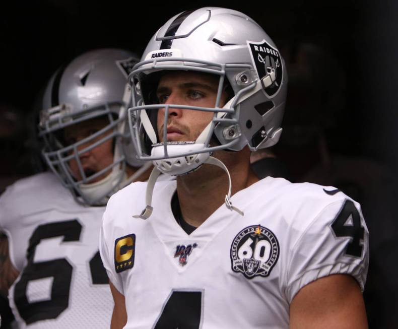 Oakland Raiders quarterback Derek Carr (4) waits to lead his team on the field before an NFL ga ...