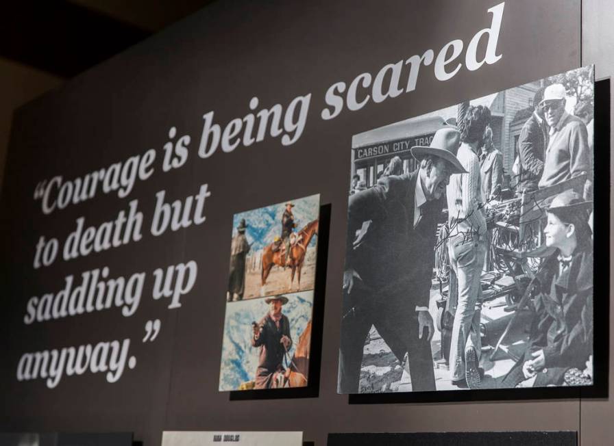 Photographs of movie icon John Wayne line the walls of the "John Wayne: Spirit of the West ...