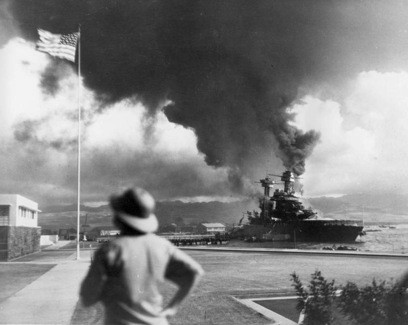 American ships burn during the Japanese attack on Pearl Harbor, Hawaii, in this Dec. 7, 1941 fi ...