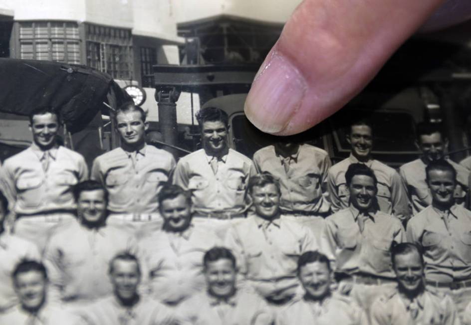 U.S. Army Air Corps veteran Edward Hall, a 95-year-old survivor of Pearl Harbor, points to a pi ...