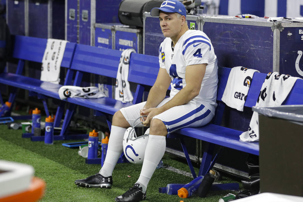 Indianapolis Colts kicker Adam Vinatieri (4) on the bench following two missed field goals agai ...