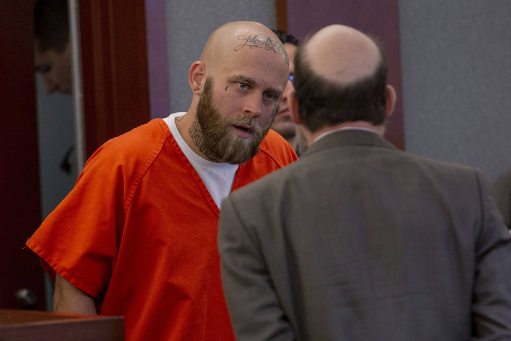 Bayzle Morgan, left, speaks with his defense attorney Dayvid Figler during a hearing at the Reg ...