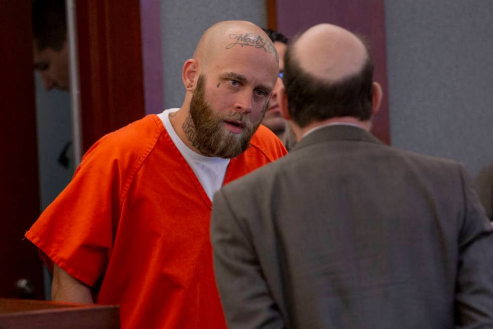 Bayzle Morgan, left, speaks with his defense attorney Dayvid Figler during a hearing at the Reg ...