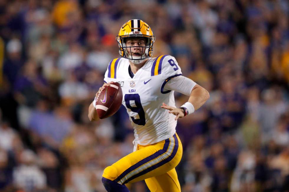 LSU quarterback Joe Burrow (9) scrambles during the first half of an NCAA college football game ...