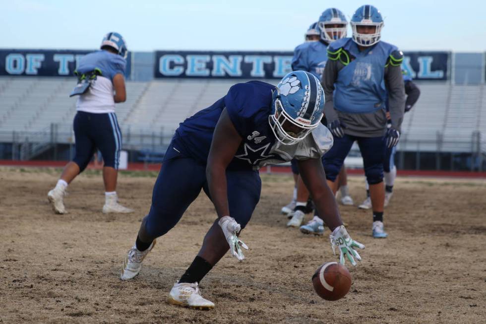 Centennial's Keaun Jackson picks up a loose ball during a team practice drill at Centennial Hig ...