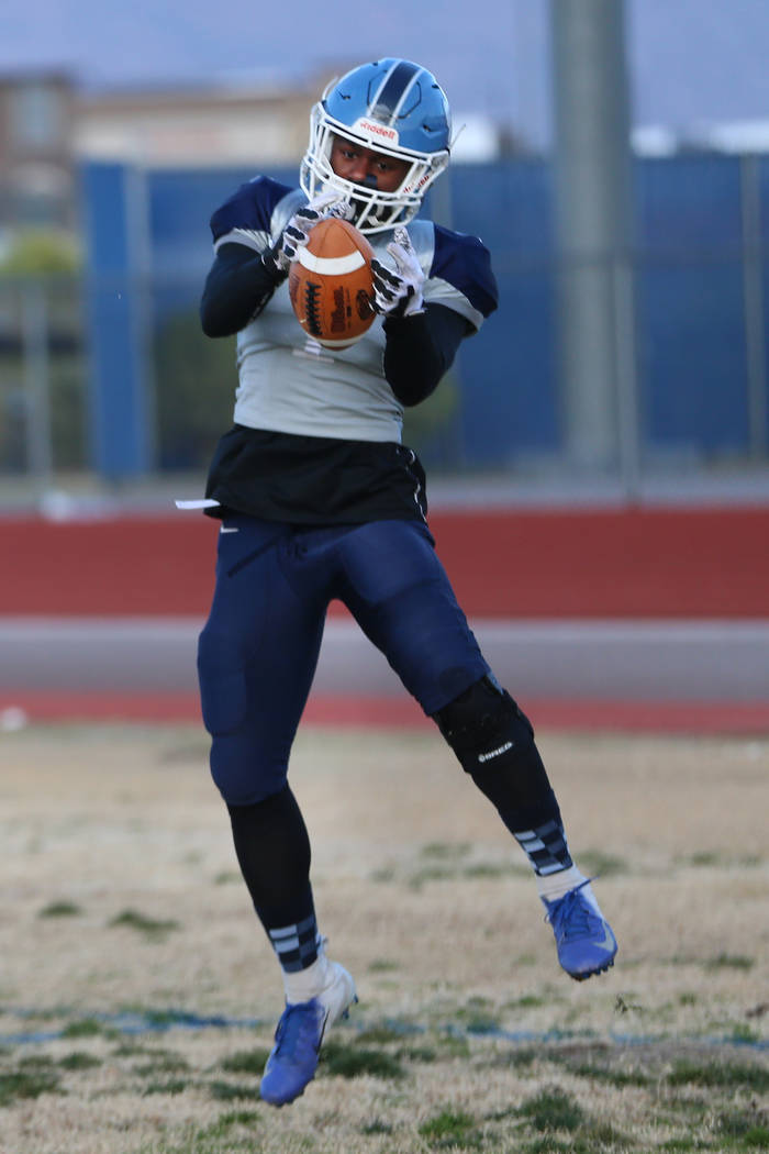 Centennial's running back Jordan Smith makes a catch during a team practice at Centennial High ...