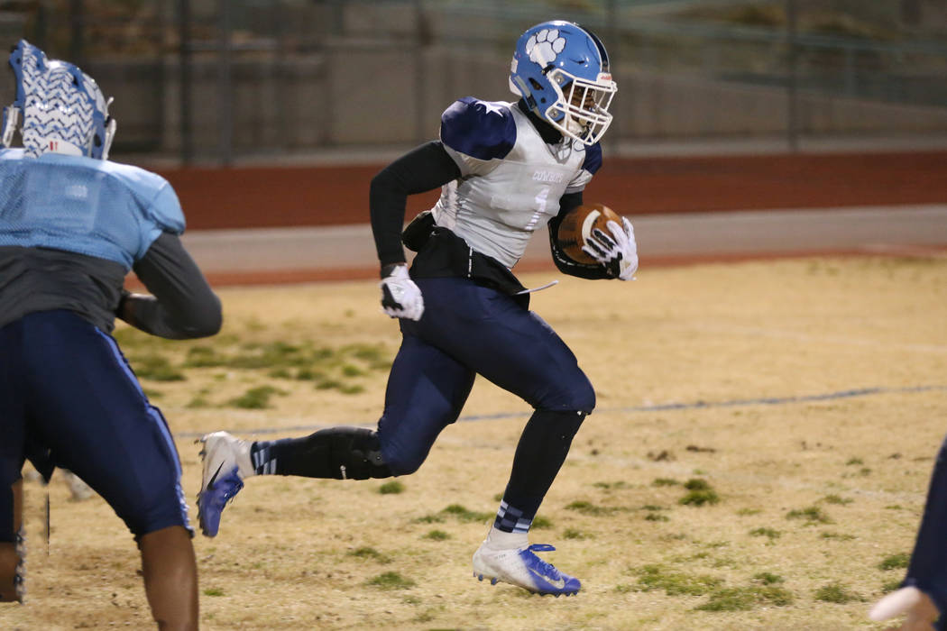 Centennial's running back Jordan Smith runs the ball during a team practice at Centennial High ...