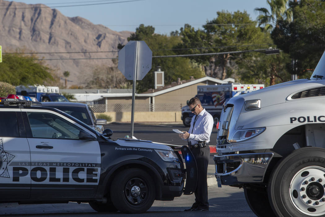 Las Vegas police respond to a barricade situation with an armed male near the 100 block of Bel ...