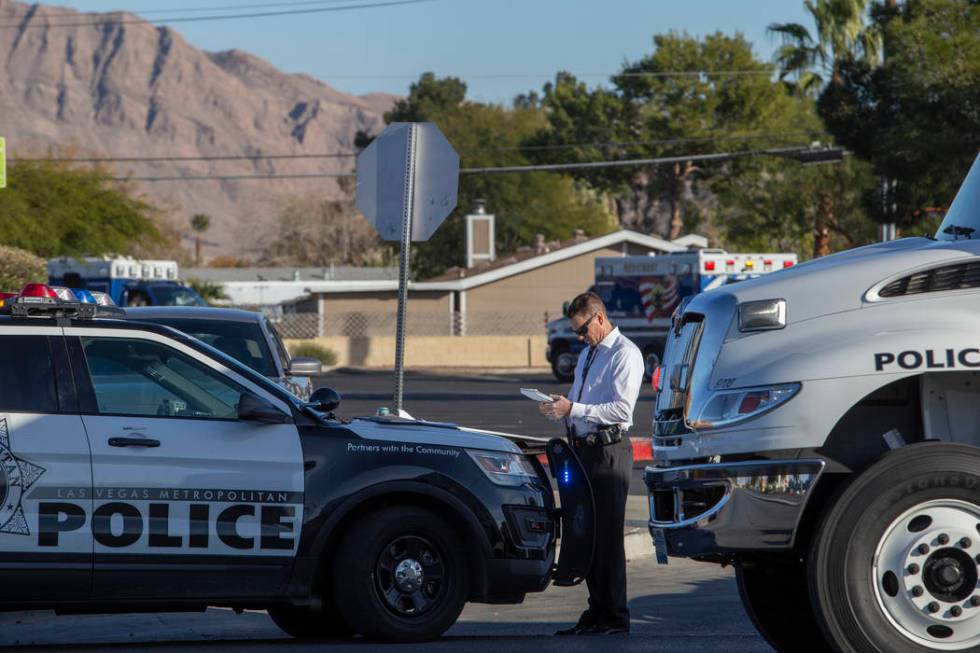 Las Vegas police respond to a barricade situation with an armed male near the 100 block of Bel ...