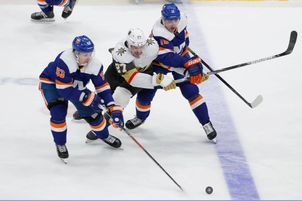 New York Islanders center Casey Cizikas (53) takes control of the puck as Vegas Golden Knights ...