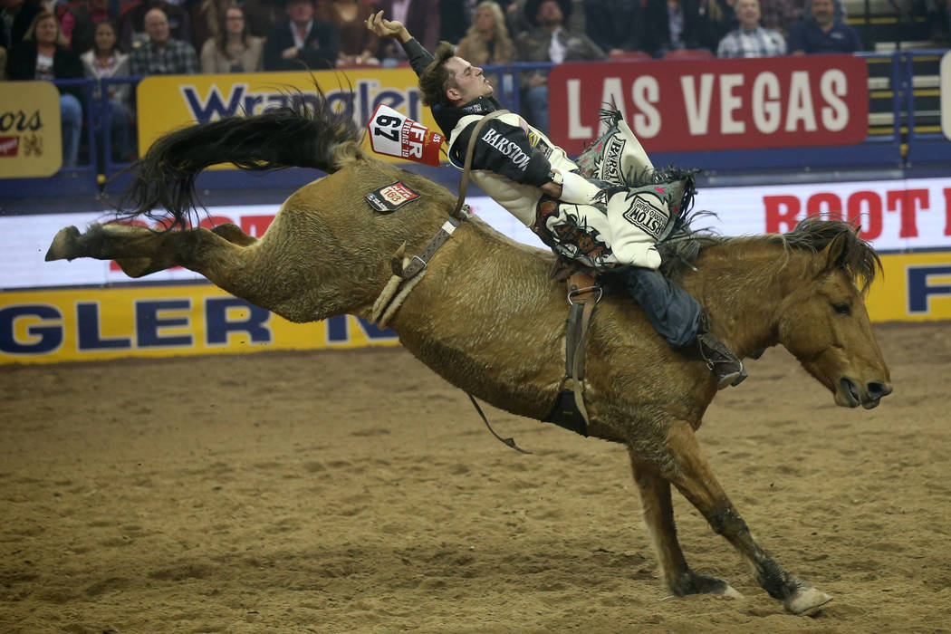 Austin Foss of Terrebonne, Ore. rides Painted River to a score of 86 in the Bareback Riding com ...