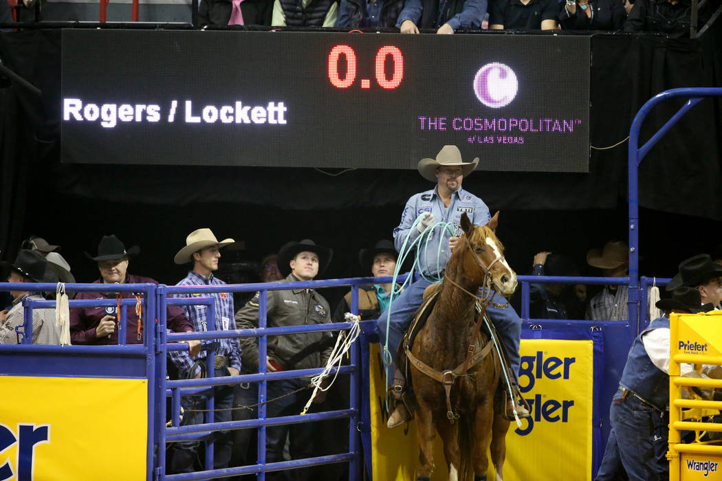 Kyle Lockett of Visalia, Calif. prepares to compete in Team Roping with Erich Rogers of Round R ...