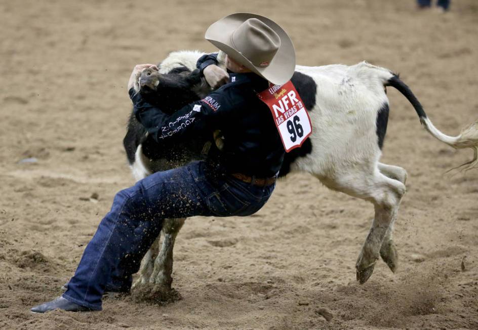 Dakota Eldridge of Elko competes in Steer Wrestling during the second go-around of the Wrangler ...