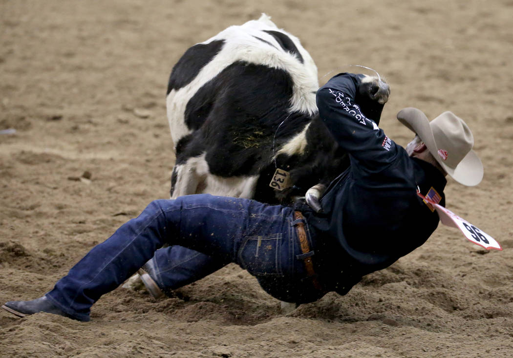 Dakota Eldridge of Elko competes in Steer Wrestling during the second go-around of the Wrangler ...