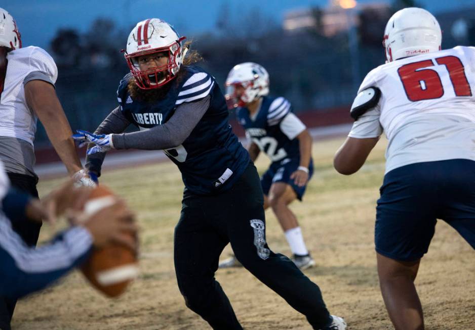 Liberty High School offensive linebacker Toa Tai (10) runs scenarios during football practice a ...