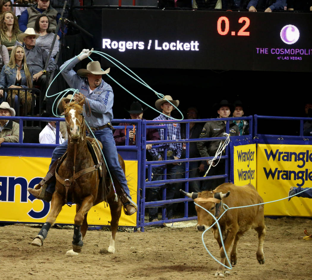 Kyle Lockett of Visalia, Calif. competes in Team Roping with Erich Rogers of Round Rock, Ariz. ...