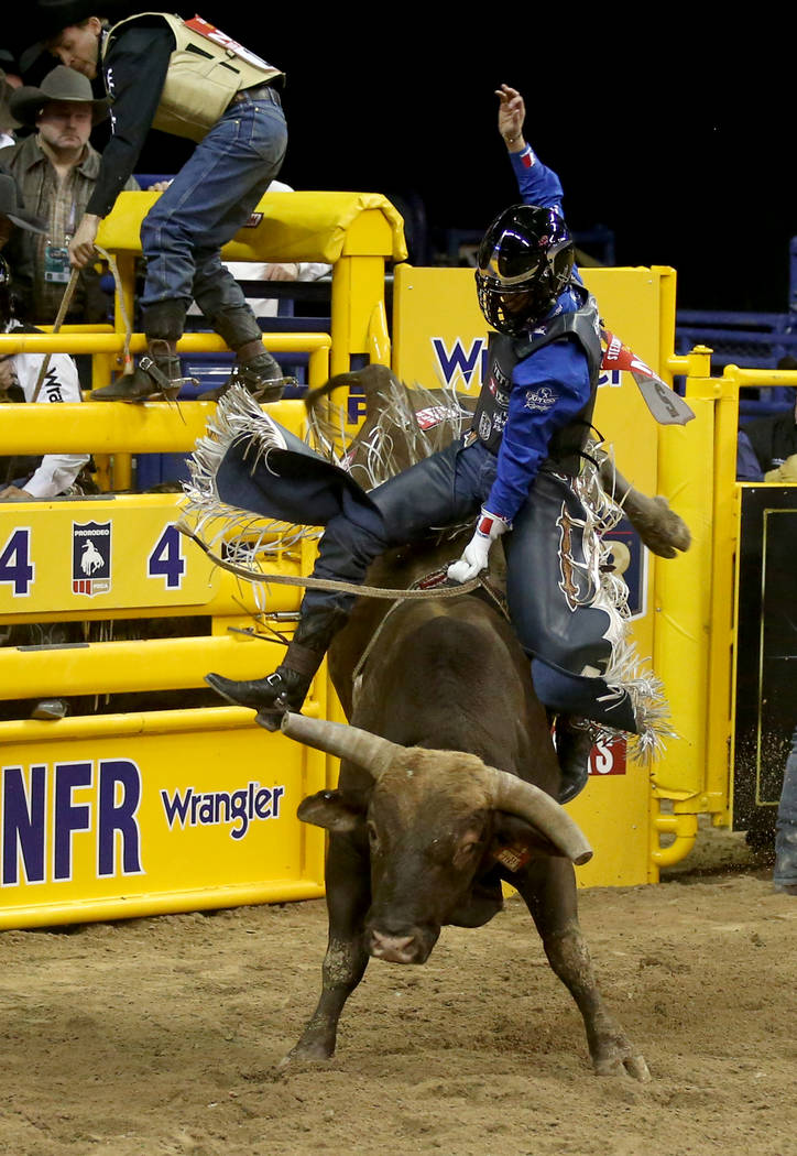 Stetson Wright of Milford, Utah, rides Monte Walsh to a score of 92.5 to win the first go-aroun ...