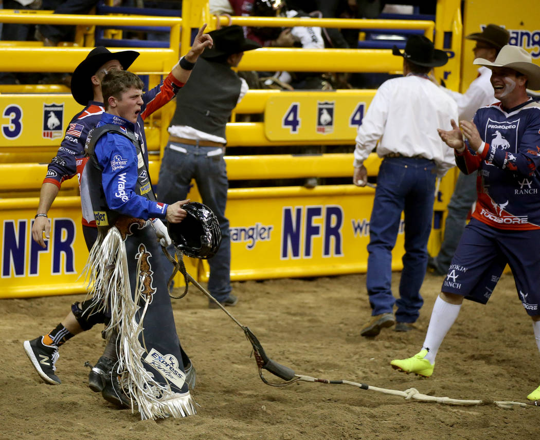 Bull rider Stetson Wright of Milford, Utah, celebrates his 92.5 ride on Monte Walsh which won t ...