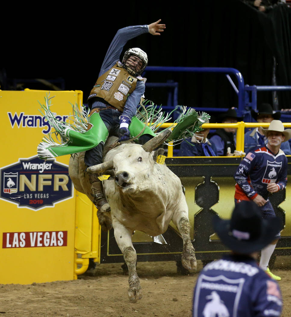 Jordan Spears of Redding, Calif. rides Dilligaf to a score of 82.5 in the Bull Riding competiti ...