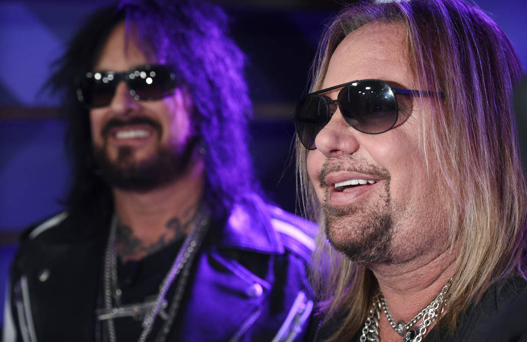 Nikki Sixx, left, and Vince Neil of Motley Crue are interviewed following a news conference to ...
